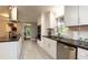 Modern kitchen featuring stainless steel appliances, white cabinets, and a breakfast bar at 2948 Legion Lake Rd, Douglasville, GA 30135