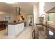 Modern kitchen featuring stainless steel appliances, granite countertops, and an island with a cooktop at 2948 Legion Lake Rd, Douglasville, GA 30135