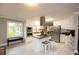 Modern kitchen with stainless steel appliances, an island, and a window overlooking the backyard at 2948 Legion Lake Rd, Douglasville, GA 30135
