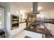 Modern kitchen featuring stainless steel appliances, granite countertops, and ample cabinet space at 2948 Legion Lake Rd, Douglasville, GA 30135