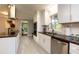 Modern kitchen featuring white cabinets, stainless steel appliances, and dark countertops at 2948 Legion Lake Rd, Douglasville, GA 30135