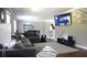 Comfortable living room features an oversized sectional, hardwood floors, and a modern entertainment center at 2948 Legion Lake Rd, Douglasville, GA 30135