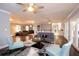 Open-concept living room with modern furnishings, hardwood floors, and plenty of natural light at 2948 Legion Lake Rd, Douglasville, GA 30135