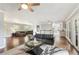 Bright, open-concept living room with modern furnishings, hardwood floors, ceiling fans and tons of sunlight at 2948 Legion Lake Rd, Douglasville, GA 30135