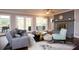 Inviting living room showcasing a fireplace, comfortable seating, and large windows for natural light at 2948 Legion Lake Rd, Douglasville, GA 30135