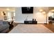 Spacious living room featuring hardwood floors, TV and gray paint color at 2948 Legion Lake Rd, Douglasville, GA 30135