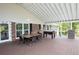Spacious covered deck with dining, foosball, and a grill, perfect for entertaining at 2948 Legion Lake Rd, Douglasville, GA 30135