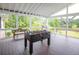 Enjoy the outdoors on this covered deck with foosball table, bench, and grill for entertaining at 2948 Legion Lake Rd, Douglasville, GA 30135