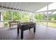 The back porch has a foosball table, grill, and views of the water at 2948 Legion Lake Rd, Douglasville, GA 30135