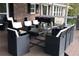 Enclosed back patio has dining for eight with views of surrounding foliage at 2948 Legion Lake Rd, Douglasville, GA 30135