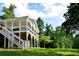 Charming outdoor living space with a screened porch overlooking a lush green lawn at 2948 Legion Lake Rd, Douglasville, GA 30135