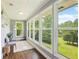 Bright sunroom features large windows with peaceful outdoor views and allows an abundance of natural light at 2948 Legion Lake Rd, Douglasville, GA 30135