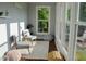 Cozy sunroom with ample windows for natural light, creating a serene space to unwind and relax at 2948 Legion Lake Rd, Douglasville, GA 30135