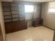 Basement office with desk, built-in shelves, and a window providing natural light at 5790 Northspring Dr, Ellenwood, GA 30294