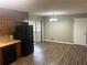 Eat in kitchen with a black refrigerator and dining space with sliding glass doors at 5790 Northspring Dr, Ellenwood, GA 30294
