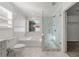 Beautiful bathroom featuring marble tile, a large soaking tub, and a glass-enclosed shower with a grab bar at 1183 Lanier Springs Dr, Buford, GA 30518