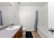 A full bathroom showcasing a single sink vanity, bath tub, and shower with coordinated neutral finishes at 1183 Lanier Springs Dr, Buford, GA 30518