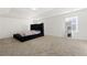 A spacious main bedroom showcases a luxurious bed frame and plush carpeting at 1183 Lanier Springs Dr, Buford, GA 30518
