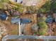 An aerial view of a property showcasing a well-maintained yard and mature trees in a neighborhood setting at 1893 Kenwood Se Rd, Smyrna, GA 30082