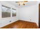 Bright bedroom with hardwood floors, white walls, and large windows offering natural light at 1893 Kenwood Se Rd, Smyrna, GA 30082