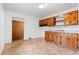 Functional kitchen featuring wood cabinetry and ample countertop space at 1893 Kenwood Se Rd, Smyrna, GA 30082