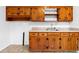 Efficient kitchen with wooden cabinets and durable vinyl flooring at 1893 Kenwood Se Rd, Smyrna, GA 30082