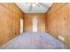Spacious room with wood paneled walls and ample space for furniture or activities at 1893 Kenwood Se Rd, Smyrna, GA 30082
