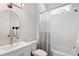Bright bathroom features a tub, shower, and a modern vanity with a sink at 1055 Amarose Ne Ln, Marietta, GA 30066