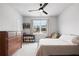 Bright bedroom features a large window, a ceiling fan, and a neutral color scheme at 1055 Amarose Ne Ln, Marietta, GA 30066