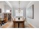 Well-lit dining room with a large table, seating for eight, and a view of the living room at 1055 Amarose Ne Ln, Marietta, GA 30066