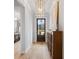 Stylish entryway with wood floors, a decorative chandelier, a wood cabinet, and light gray walls at 1055 Amarose Ne Ln, Marietta, GA 30066