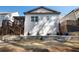Back exterior with steps and an outdoor patio with unique hanging swing chairs at 1055 Amarose Ne Ln, Marietta, GA 30066