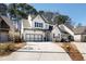 Stunning two-story home with a modern farmhouse design and a spacious driveway at 1055 Amarose Ne Ln, Marietta, GA 30066