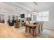 Open concept living room and dining area with hardwood floors and abundant natural light at 1055 Amarose Ne Ln, Marietta, GA 30066