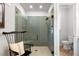 Modern walk-in shower featuring green subway tiles, a rainfall shower head, and a built-in bench at 1055 Amarose Ne Ln, Marietta, GA 30066