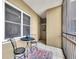 Cozy enclosed balcony features a bistro table set, rug and large windows at 300 Peachtree Ne St # 6H, Atlanta, GA 30308