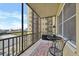 Spacious balcony featuring wrought iron railings and a seating area with views of the city at 300 Peachtree Ne St # 6H, Atlanta, GA 30308