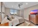 Cozy bedroom with a large window, wooden dresser, and soft, neutral decor at 300 Peachtree Ne St # 6H, Atlanta, GA 30308