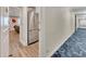 Hallway view into a kitchen and living room at 300 Peachtree Ne St # 6H, Atlanta, GA 30308
