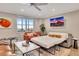 Cozy living room featuring a sleeper sofa and city views at 300 Peachtree Ne St # 6H, Atlanta, GA 30308