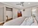 Comfortable main bedroom with ceiling fan, television, and connected ensuite bathroom at 300 Peachtree Ne St # 6H, Atlanta, GA 30308