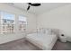 Cozy bedroom with neutral colors, a large bed, and bright windows at 3933 Danube Ln # 221, Atlanta, GA 30339