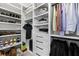 Organized walk-in closet with shelves, drawers, and hanging rods for ample storage at 3933 Danube Ln # 221, Atlanta, GA 30339