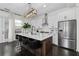 Modern kitchen with stainless steel appliances, quartz countertops, and breakfast bar seating at 3933 Danube Ln # 221, Atlanta, GA 30339