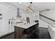 Modern kitchen with stainless steel appliances, quartz countertops, and breakfast bar seating at 3933 Danube Ln # 221, Atlanta, GA 30339