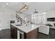 Modern kitchen featuring an island with seating, stainless appliances, and open floor plan at 3933 Danube Ln # 221, Atlanta, GA 30339