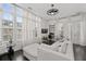 Bright living space with large windows, modern furniture, and dedicated work area at 3933 Danube Ln # 221, Atlanta, GA 30339