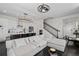 Open concept living space with modern kitchen, hardwood floors, and staircase at 3933 Danube Ln # 221, Atlanta, GA 30339
