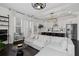 Open concept living space with hardwood floors, modern kitchen, and natural light at 3933 Danube Ln # 221, Atlanta, GA 30339
