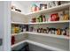 Well-organized pantry shelves stocked with a variety of food items and household supplies at 3933 Danube Ln # 221, Atlanta, GA 30339